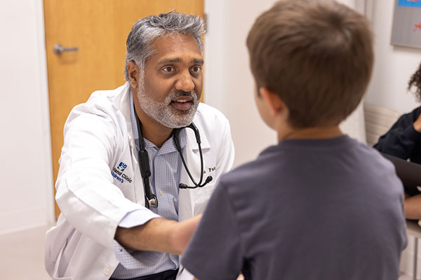 Cleveland Clinic doctor with a child patient.