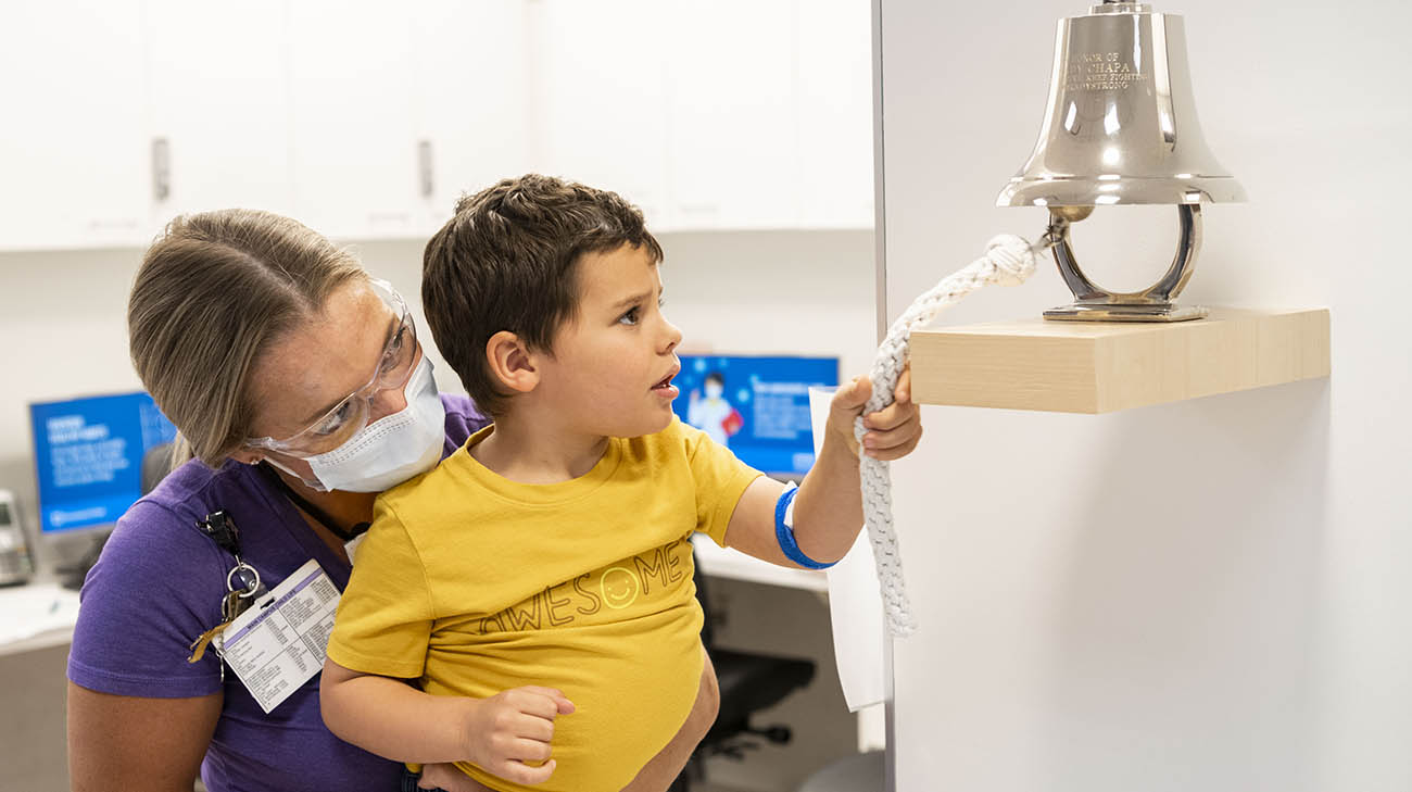 Simon Ziemba rings bell at Cleveland Clinic Children's to signify being cancer-free. 