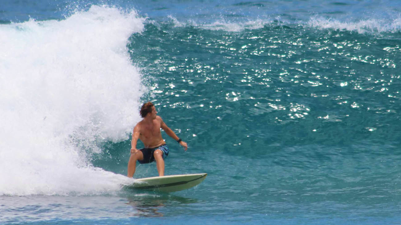 Carter surfing in Ala Moana, Hawaii, in 2019. 