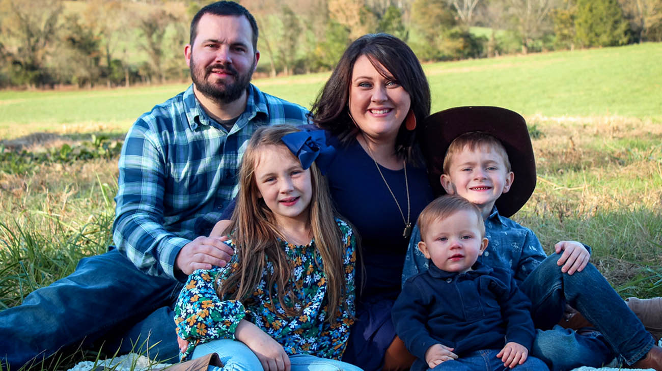 Lyra and her family, after she underwent surgery for intestinal malrotation. 