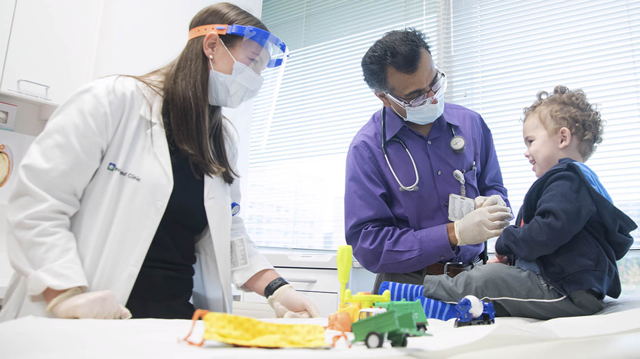 Brooks, with Dr. Kadakkal Radhakrishnan, during a follow-up appointment at Cleveland Clinic Children's. 