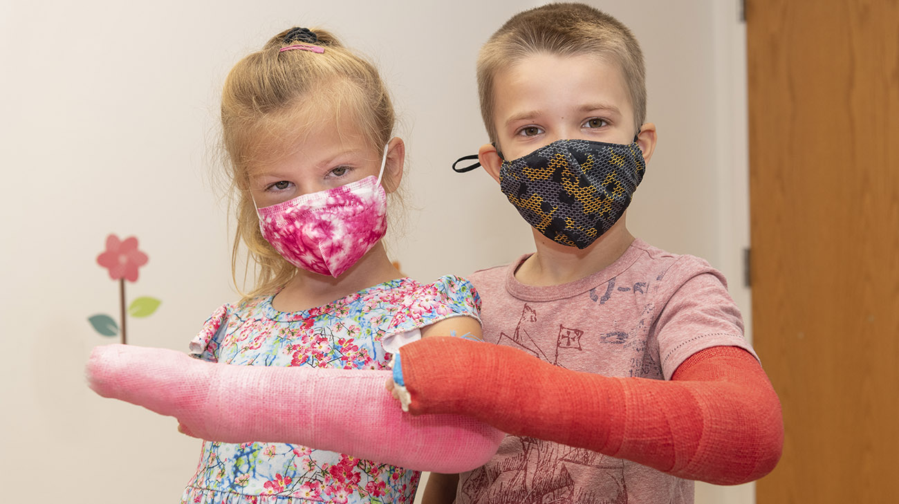 Madison Bell and friend, Tyler Bruns, showing off their casts