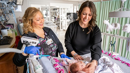 Nurses Pam and Alison caring for Maddie in the NICU.