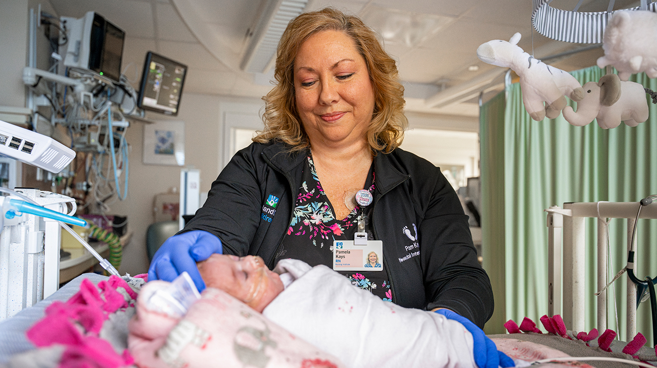 Nurse Pam taking care of Maddie in the NICU. 