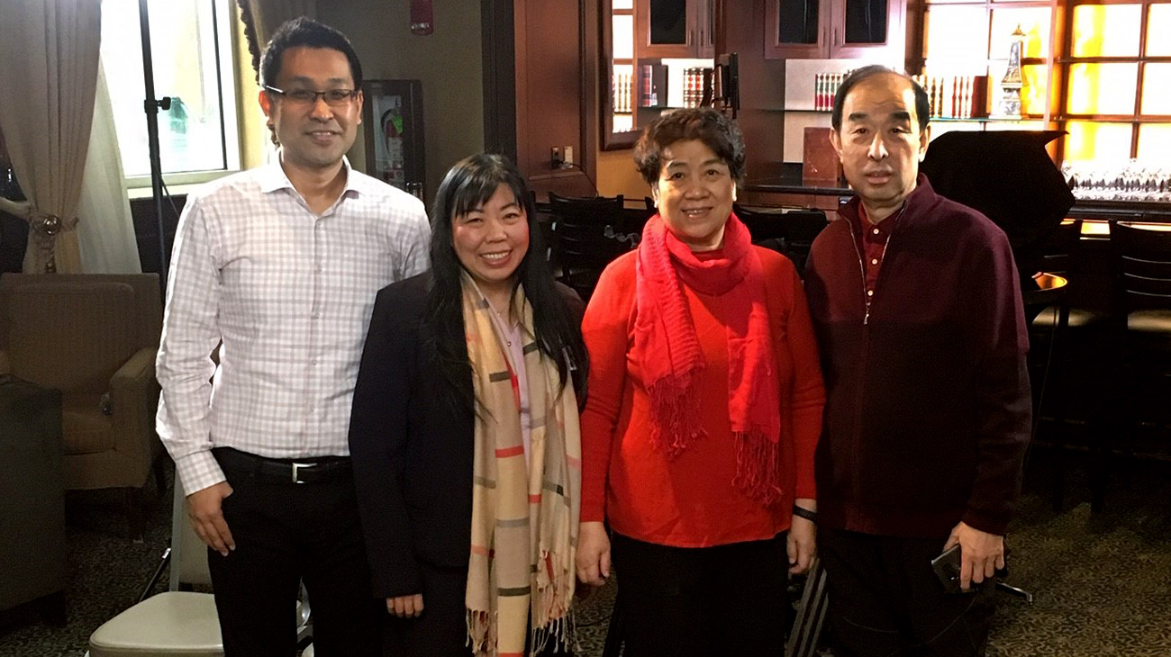 Yuehchi Weng, interpreter with Cleveland Clinic’s Global Patient Services, established a connection with the Wu family and calmed their fears when they arrived from China. Pictured, left to right: Xiaoyo Wu; Yuehchi Weng; Yuexian and Zhigang Wu.