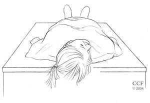 Person lying down with head turned toward right ear.