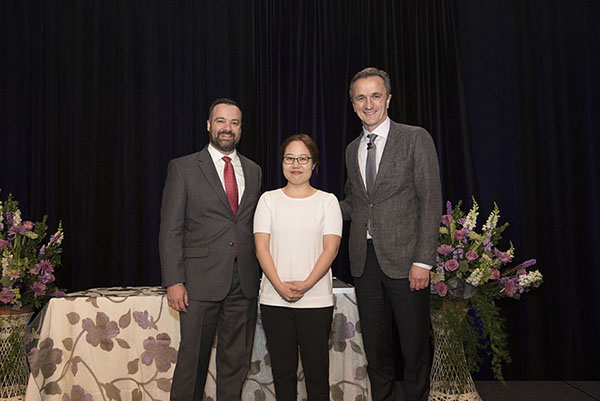 Aaron Hamilton, MD, presents the inaugural Speak-Up Award to Heeyoon Kim, MD, with Tomislav Mihaljevic, MD, CEO and President