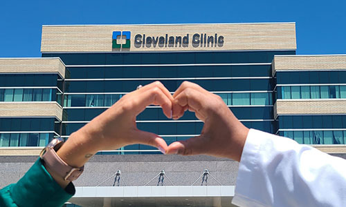 Hands making a heart over Cleveland Clinic