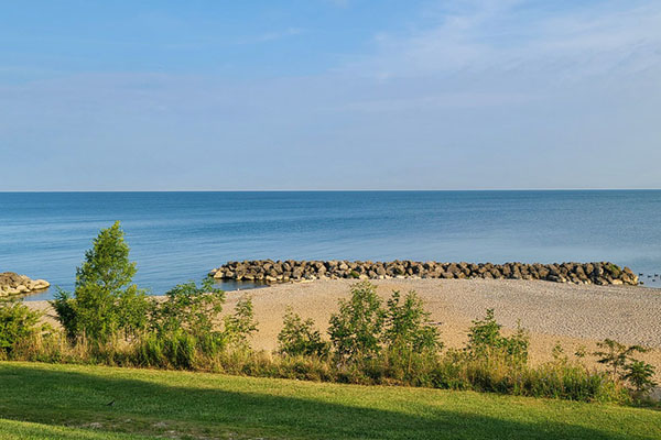 Scenic view of a beach next to a large body of water.