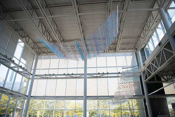 Textile sculptural installation hanging from the ceiling