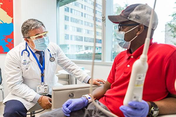 A doctor talking with a patient