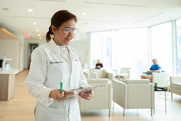 Physician walking through the waiting room at Cleveland Clinic Canada.