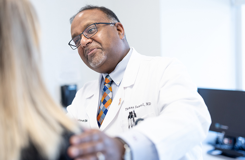 Cleveland Clinic doctor listening to a patient.