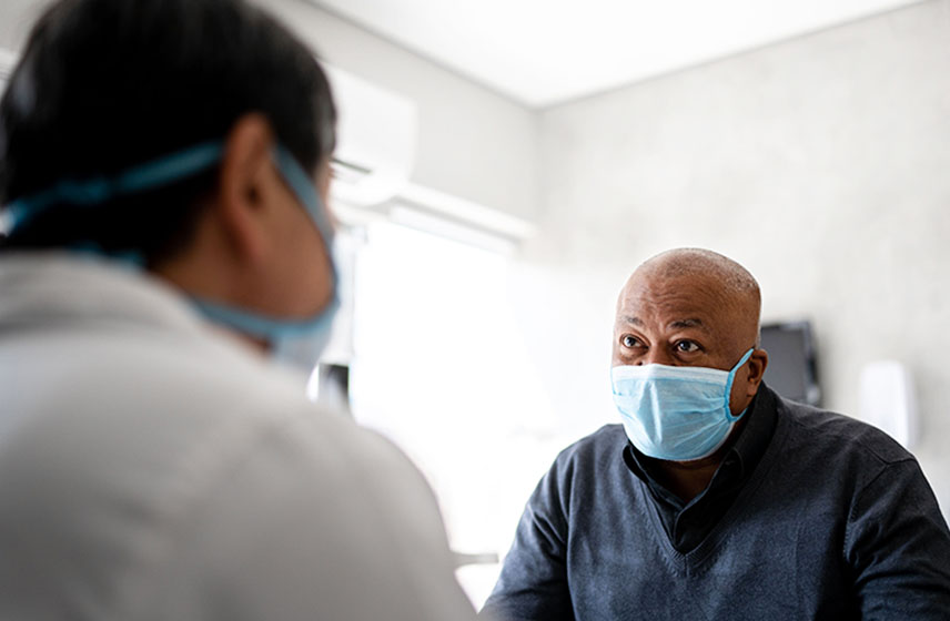 Male patient talking with his Cleveland Clinic doctor during an appointment.