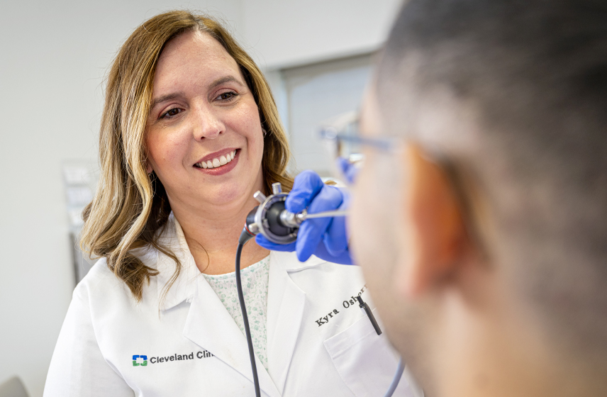 A Cleveland Clinic caregiver examining a patient's sinuses.