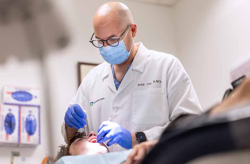 Cleveland Clinic dentist working on a patient's teeth.