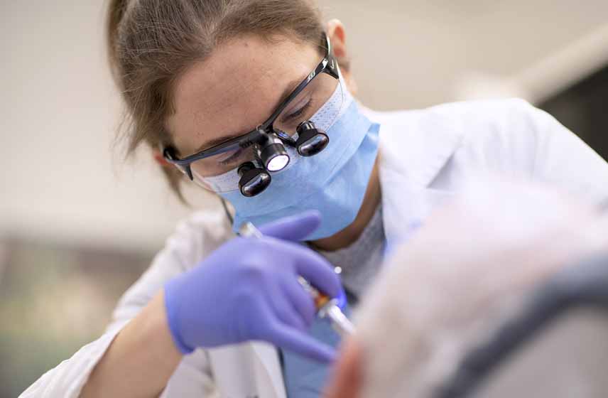 Cleveland Clinic dental specialist performs oral exam
