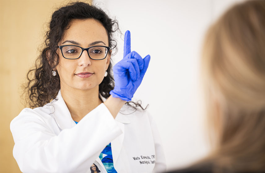 A caregiver going over X-Ray results with a patient.