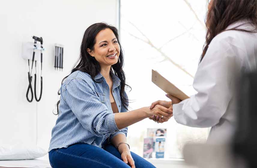 woman shaking hands with a doctor