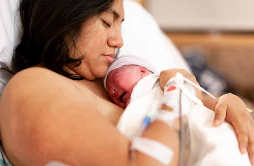mother holding a newborn