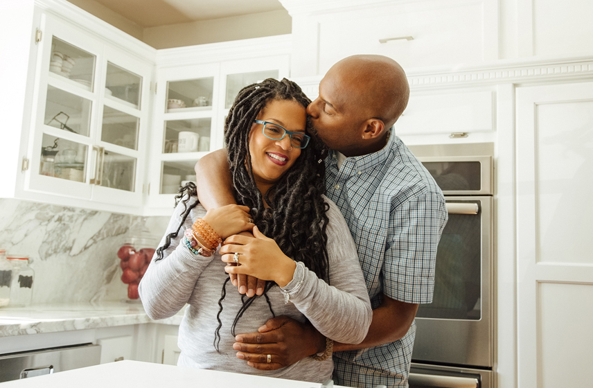 Couple hugging in a kitchen
