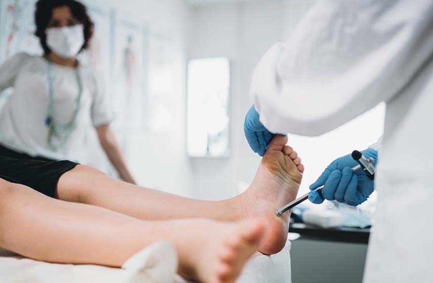 Cleveland Clinic Doctor examining a patient's foot.