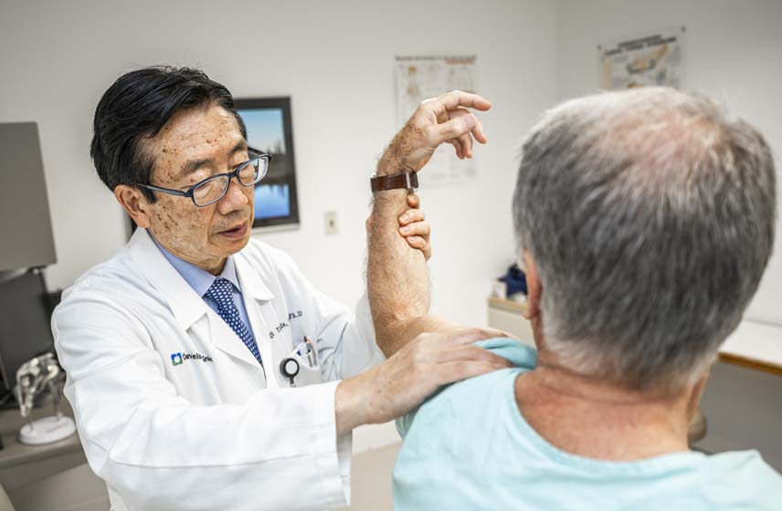 Doctor examining rotator cuff injury on a patient
