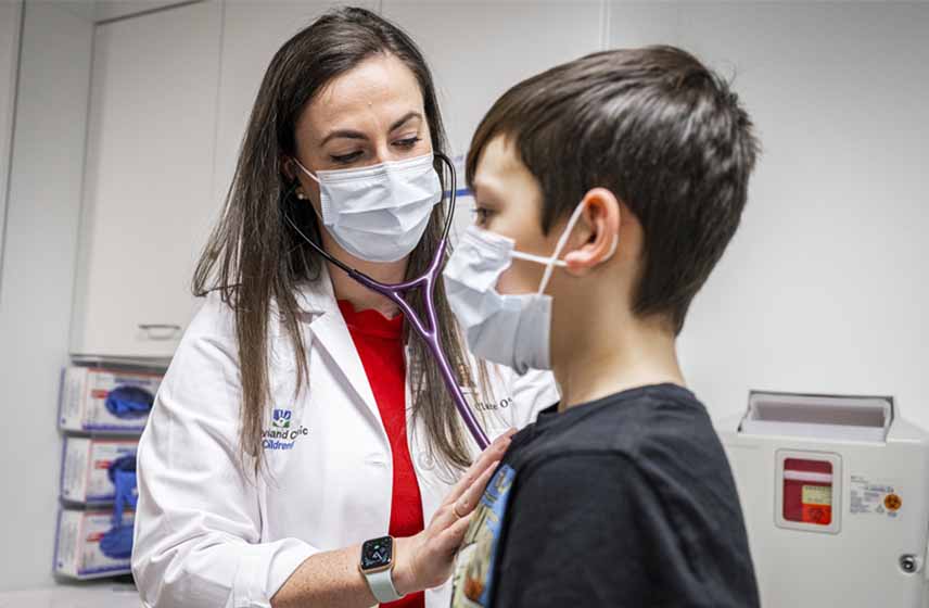 Cleveland Clinic Children's doctor examining young boy.
