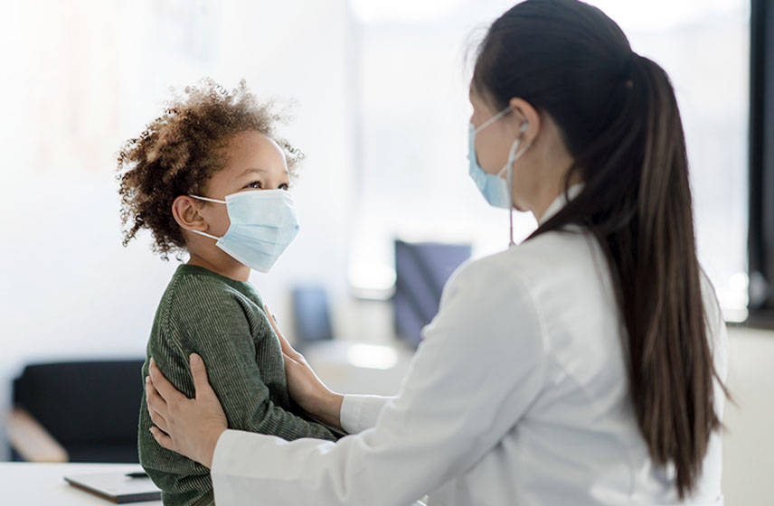 Doctor examining child with aplastic anemia