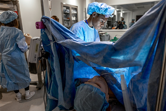 Students practicing surgery on a mannequin