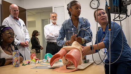 A Cleveland Clinic Caregiver giving a demonstration of an intubation on a model.