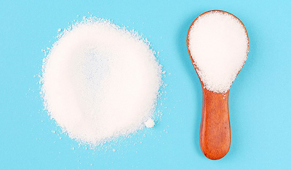 Artificial sugar and spoon
