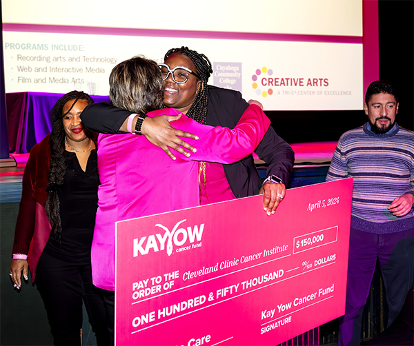 Jenny Palmateer, Kay Yow Cancer Fund CEO (left), presents a check to NaSheema Anderson, Community Outreach Department Manager, Cleveland Clinic Cancer Institute.