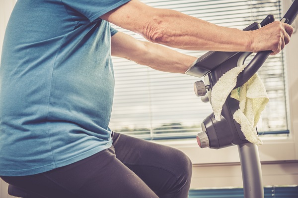 Older adult on exercise bike (Getty Images)