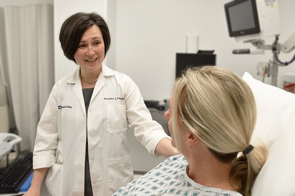 Jennifer Sabitski, MD, speaks with a patient in this 2019 photo. 