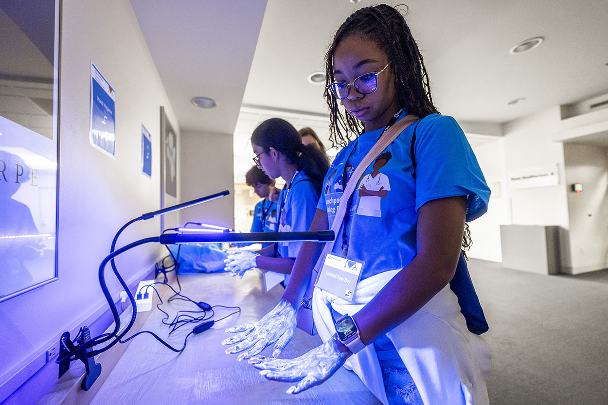 Middle and high school students learning what it's like to be a nurse.