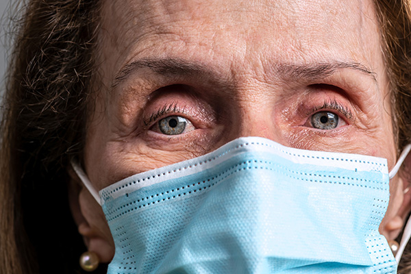 close-up of older woman wearing mask