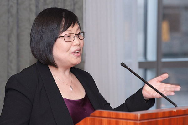 Xiaoxia Li, PhD, addresses attendees at her chair dedication