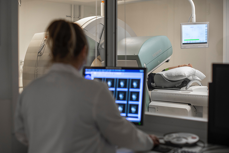 Healthcare provider reviews images from nuclear cardiac stress test.