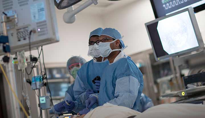 A surgeon performing thoracic (chest) surgery.