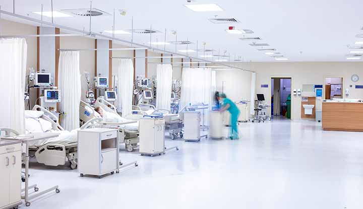 An intensive care unit with several beds and equipment to provide continuous monitoring and life support