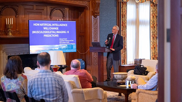 Research presentations in front of director and program faculty.