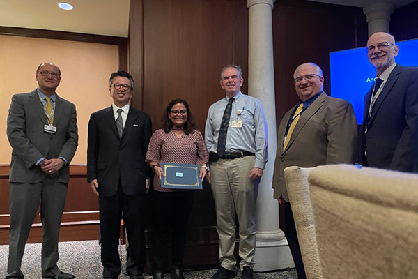 Resident receiving an award