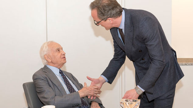 Morton Mandel shaking hands with Tom Mihaljevic, M.D.