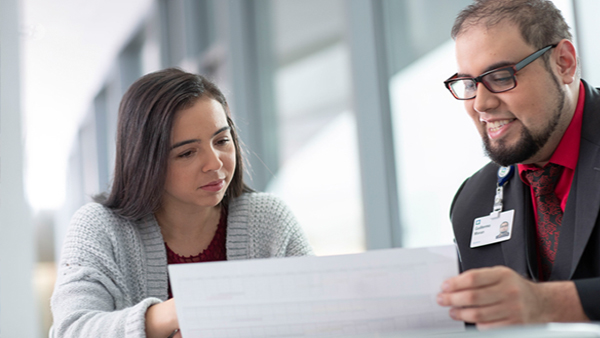 Financial Assistance representative helping patient