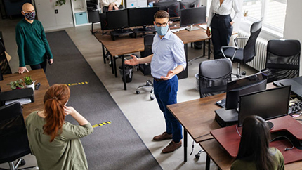 Office workers in socially distant office