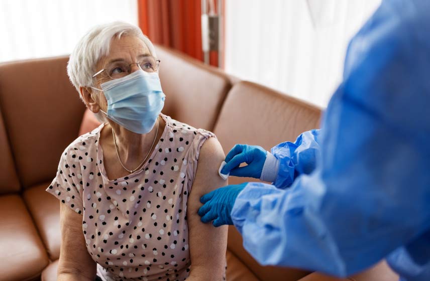 older woman getting flu shot