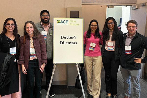 Residents attending a conference seminar titled Doctor's Dilemma.