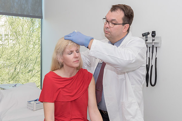 Zoltan Mari, MD performs a botulinum toxin injection.