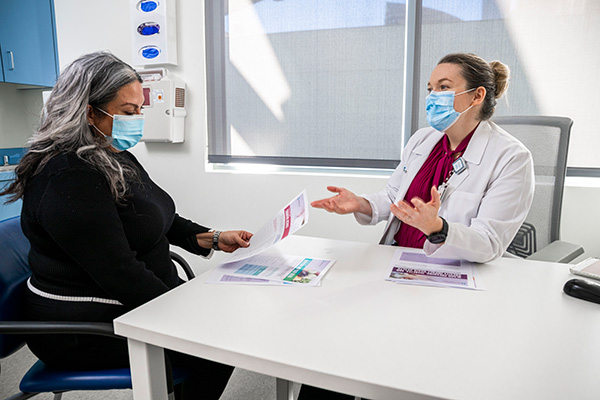 A Cleveland Clinic Nevada Caregiver discussing option with a patient at the Women’s Alzheimer’s Movement Prevention Center.